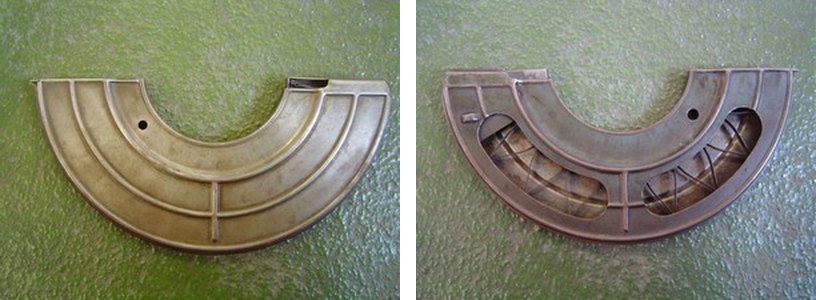 Figure 1 — A French Chauchat magazine seen from both sides. Left, the closed side, stiffened with pressed ribs. Right, the open side, with two large windows through which the follower's zig-zag spring can be …