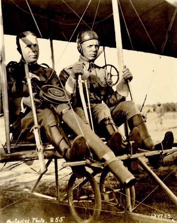 Figure 1 — Captain Charles DeForest Chandler, holding the Lewis gun, and Lieutenant Roy Kirtland seated in a Wright Model B at College Park, Maryland, on 7 June 1912, after the first firing of a machine gun f…