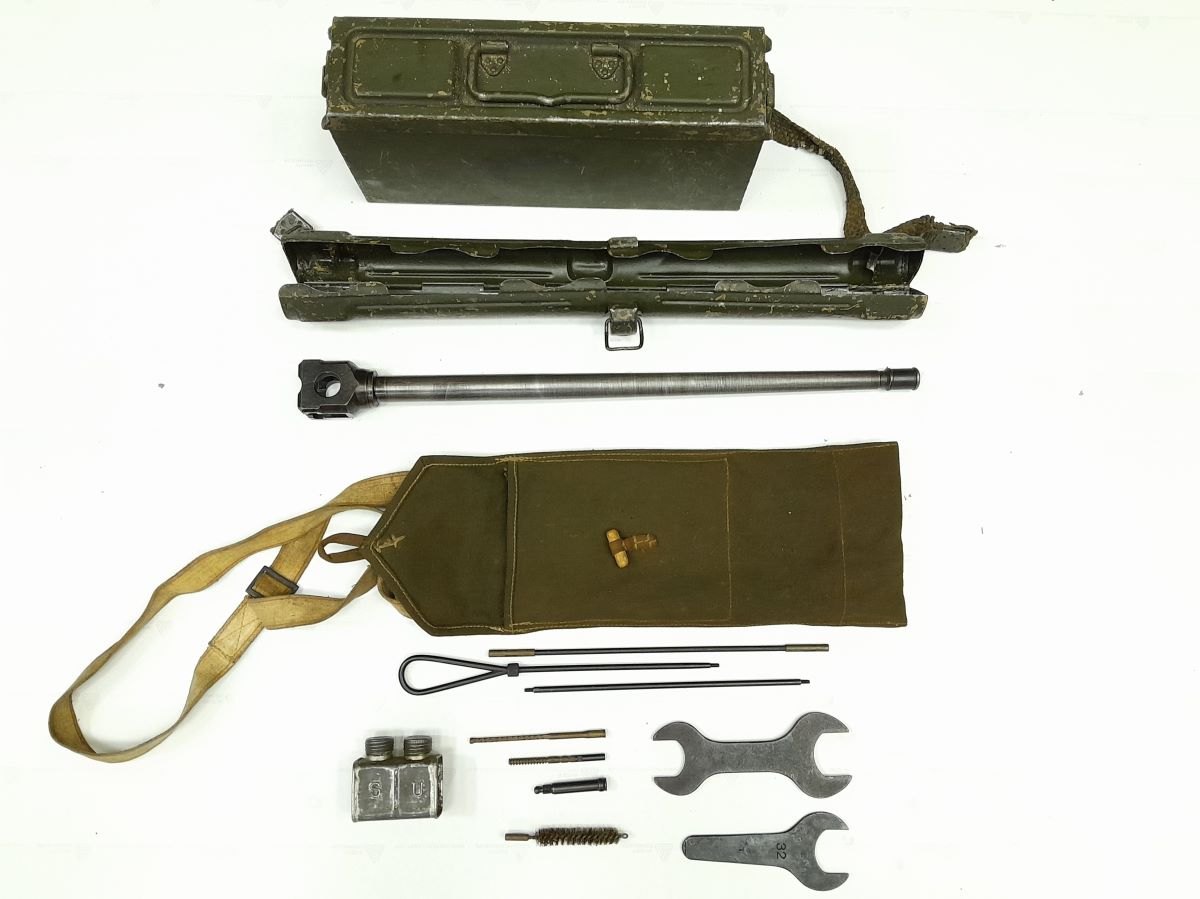 Figure 3 — Accessories recorded with an MG 42 by Romania's National Heritage Institute: an ammunition box, the spare-barrel case and spare barrel, a canvas bag and sling, a cleaning rod and brushes, an oil ca…