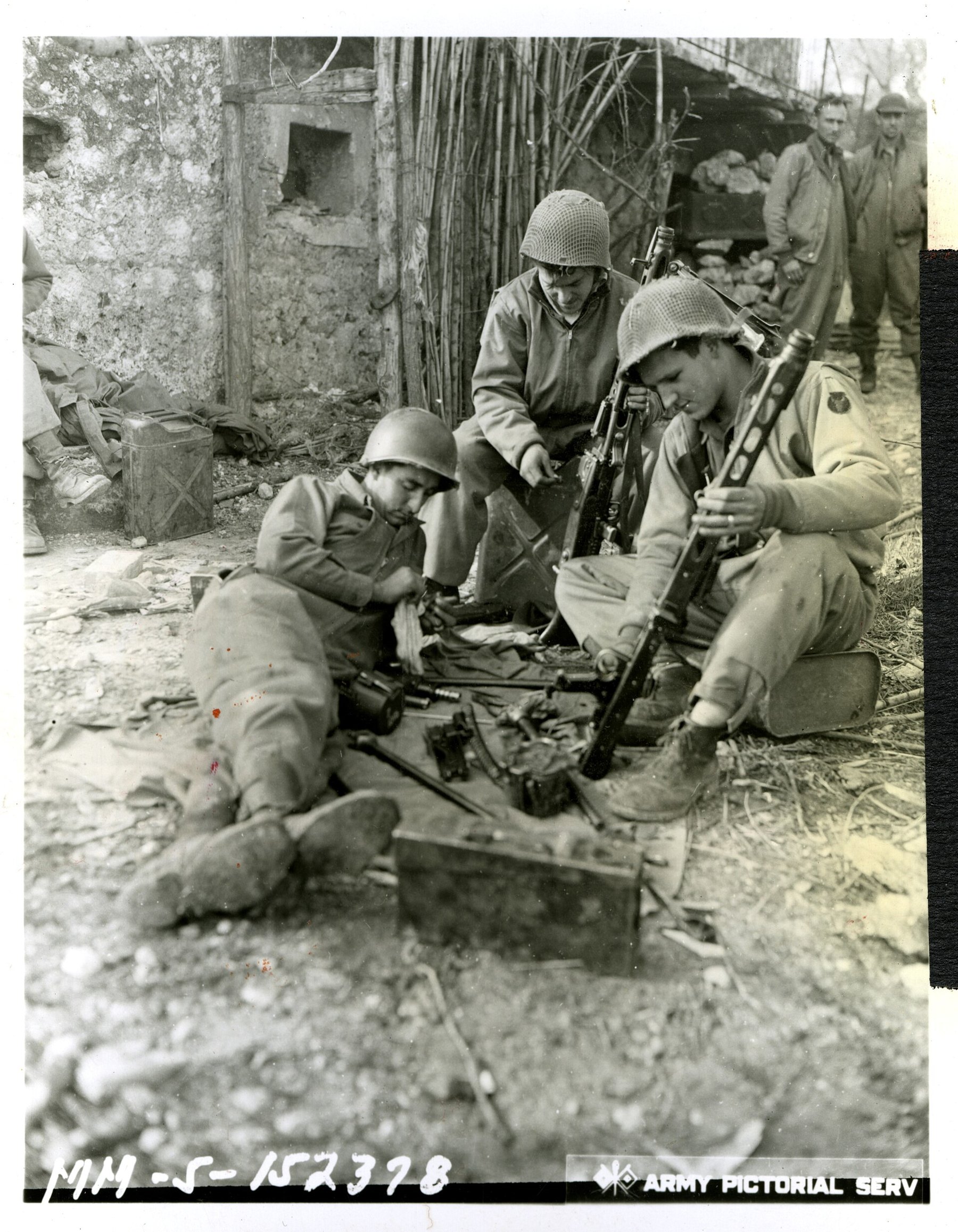 Figure 3 — US infantrymen of the 34th Infantry Division cleaning MG 42s captured at San Vittore, Italy, on 12 January 1944. Captured guns were turned on their former owners often enough that the US Army train…