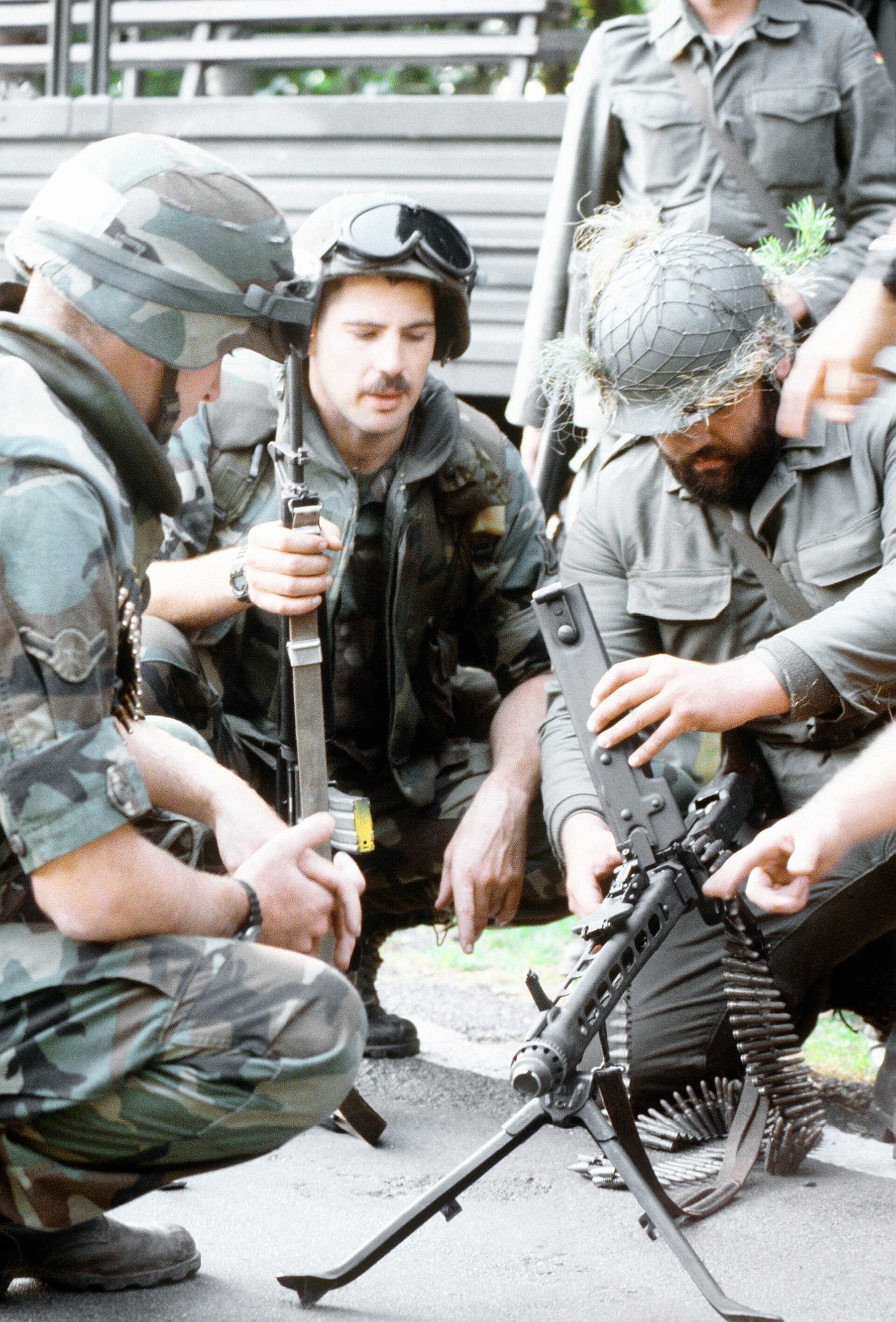 Figure 3 — A West German reservist demonstrates his MG 3 to US Air Force security police during exercise Creek Warrior, 1 September 1988. US Department of Defense photograph, public domain, via Wikimedia Comm…