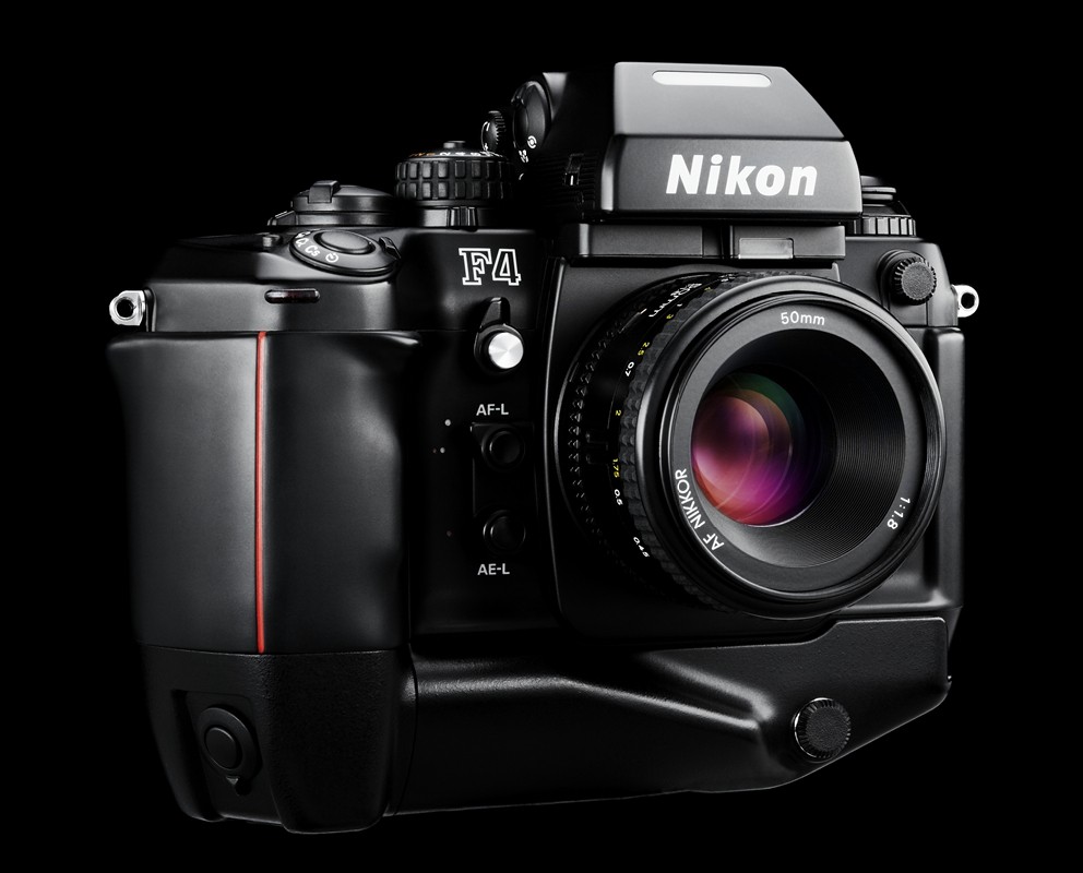 Figure 3 — A Nikon F4. Nikon's engineering, Giugiaro Design's exterior — the same division of labour Beretta bought for the Neos, and from the same studio. Photograph by Austin Calhoon via Wikimedia Commons, …