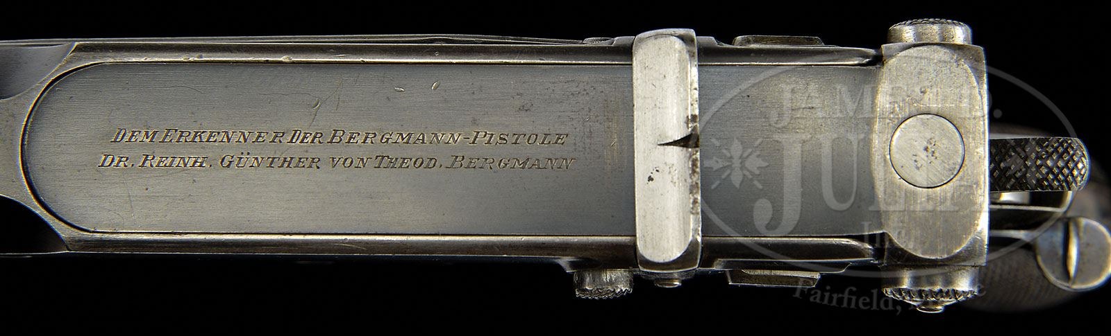 Figure 5 — The bolt cover of serial 117: DEM ERKENNER DER BERGMANN-PISTOLE / DR. REINH. GÜNTHER VON THEOD. BERGMANN. Photograph James D. Julia, Inc., Fall 2013, lot 3192A.