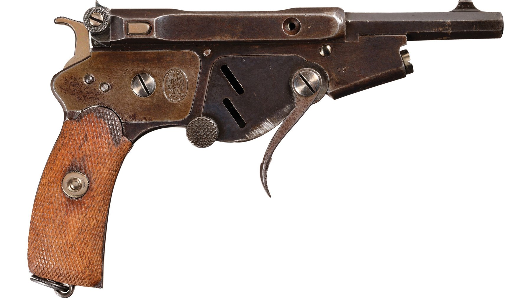 Figure 3 — Serial 19, another folding-trigger No. 2, from the right: the trigger hangs from its pivot in front of the magazine sideplate, and the oval trademark is on the rear of the frame. Photograph Rock Is…