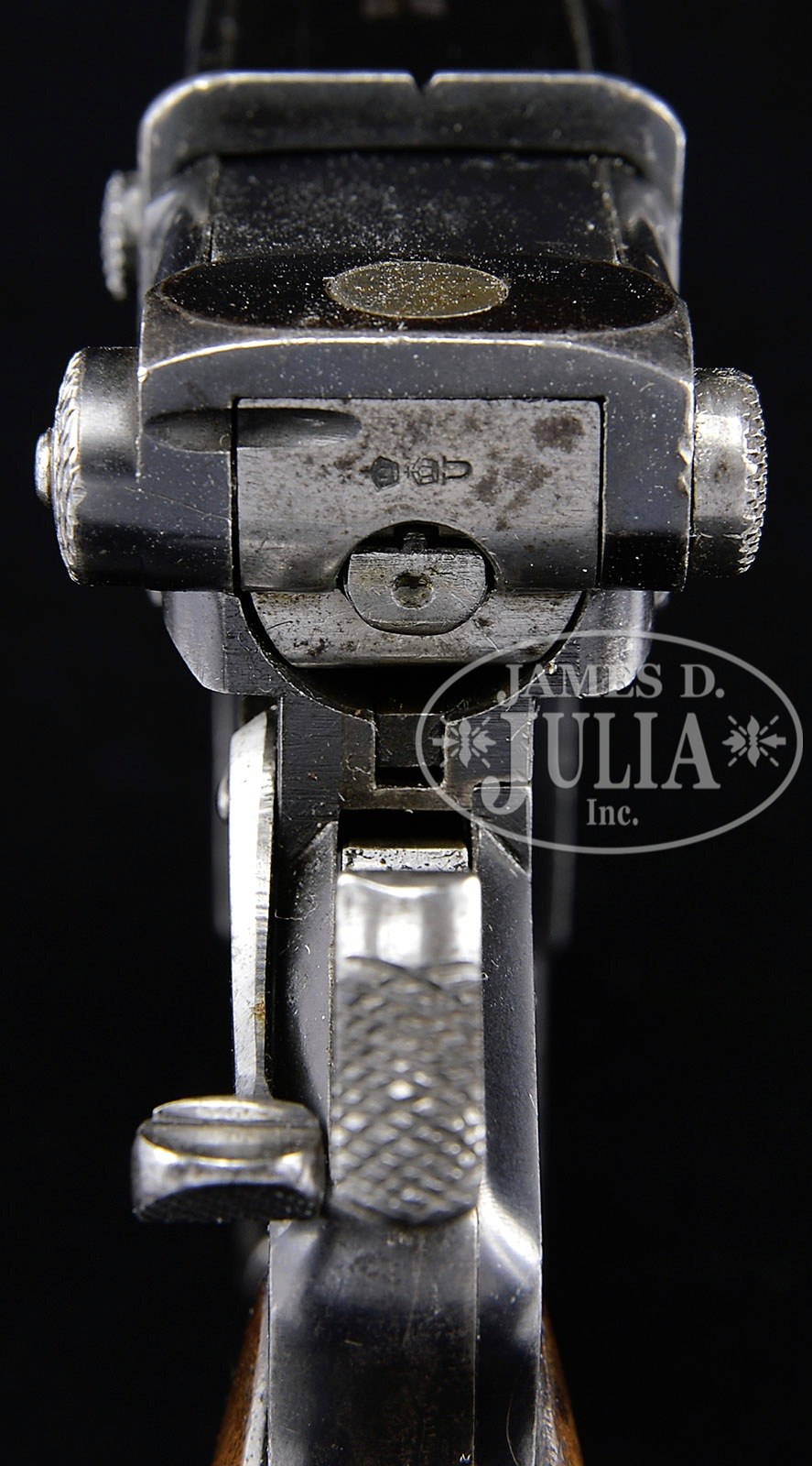 Figure 4 — Serial 96 from behind: the proof marks on the back of the bolt, knurled cocking knobs at either side of it, and the checkered hammer spur below. Photograph James D. Julia, Inc., Spring 2014, lot 3030.