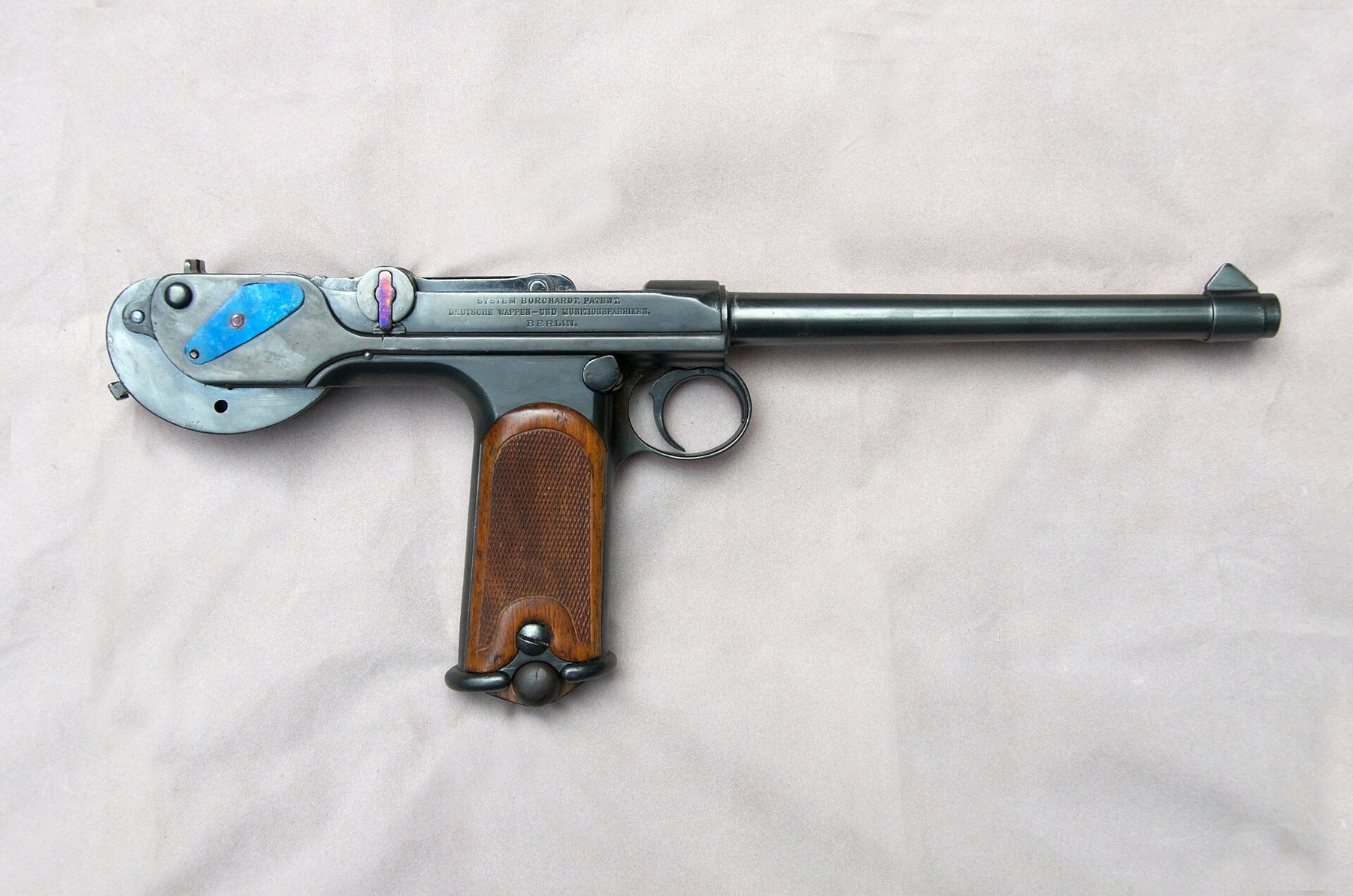Figure 8 — A DWM C-93, serial 2119, right side, showing the three-line DWM marking clearly. The same pistol is offered on a dealer page as an original pistol that has been refinished, with replacement grips, …