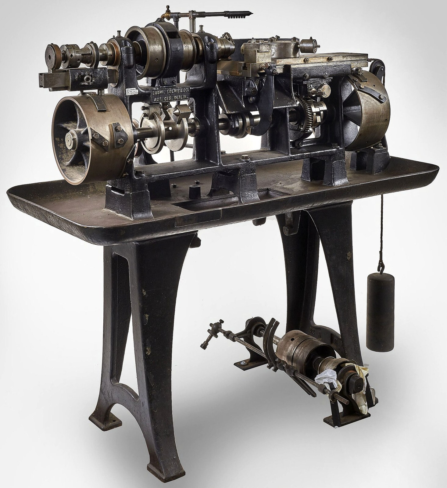 Figure 7 — An automatic turret lathe built by Ludwig Loewe & Co. of Berlin. The firm sold machine tools of this kind and used them; the C-93 is a pistol made almost entirely of machined parts, and its maker w…