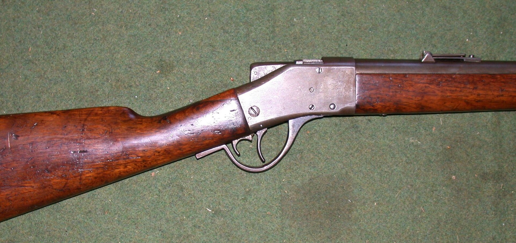 Figure 3 — A Sharps-Borchardt Model 1878 rifle. The falling-block action, worked by the lever that forms the trigger guard, is Borchardt's: the hammerless lockwork is housed in the block, which is why the rec…