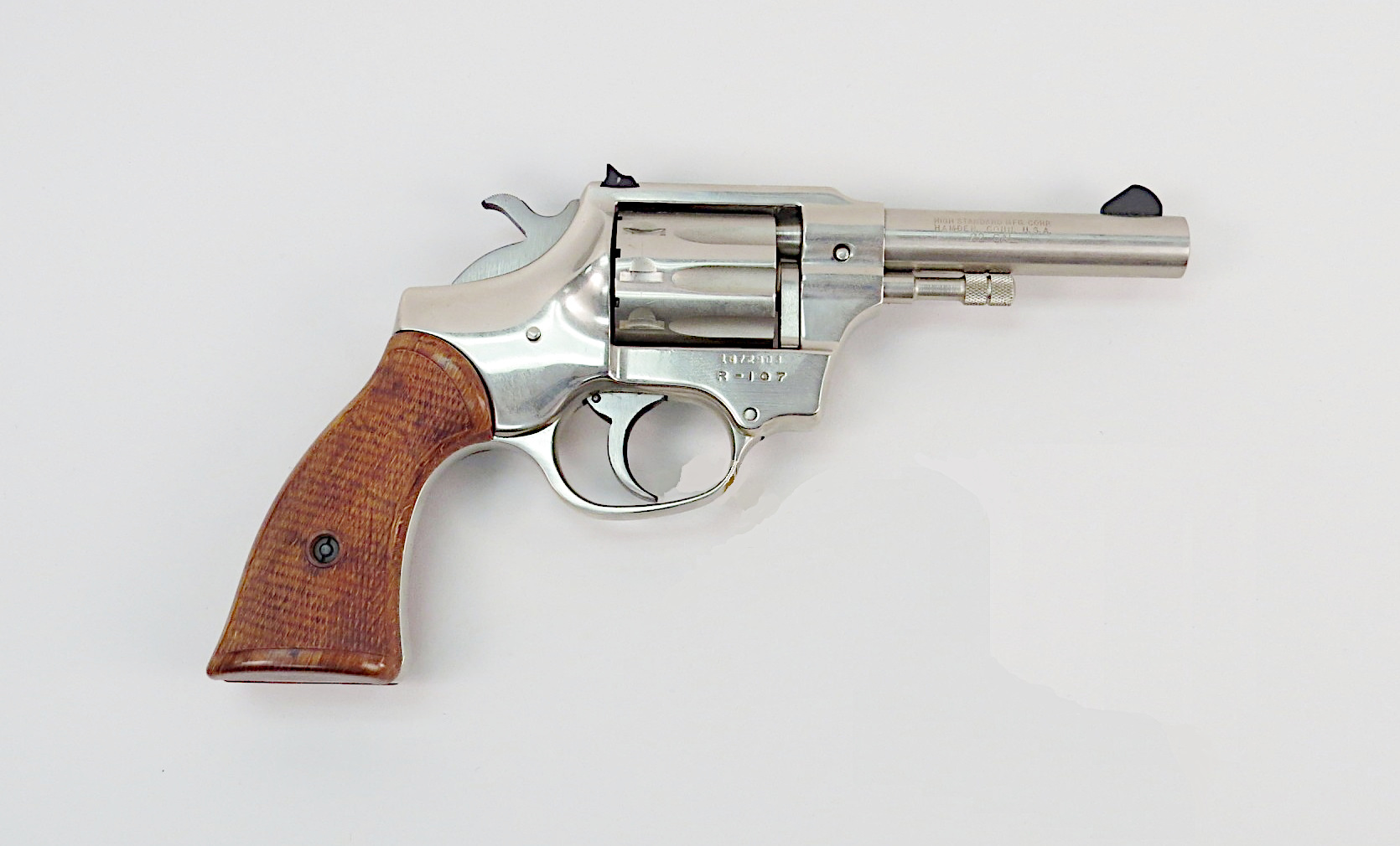 Figure 7 — A nickel Sentinel Deluxe in the Smithsonian's collection: two-piece grips, four-inch barrel, and the R-series frame with no thumb latch. Smithsonian National Museum of American History, public doma…