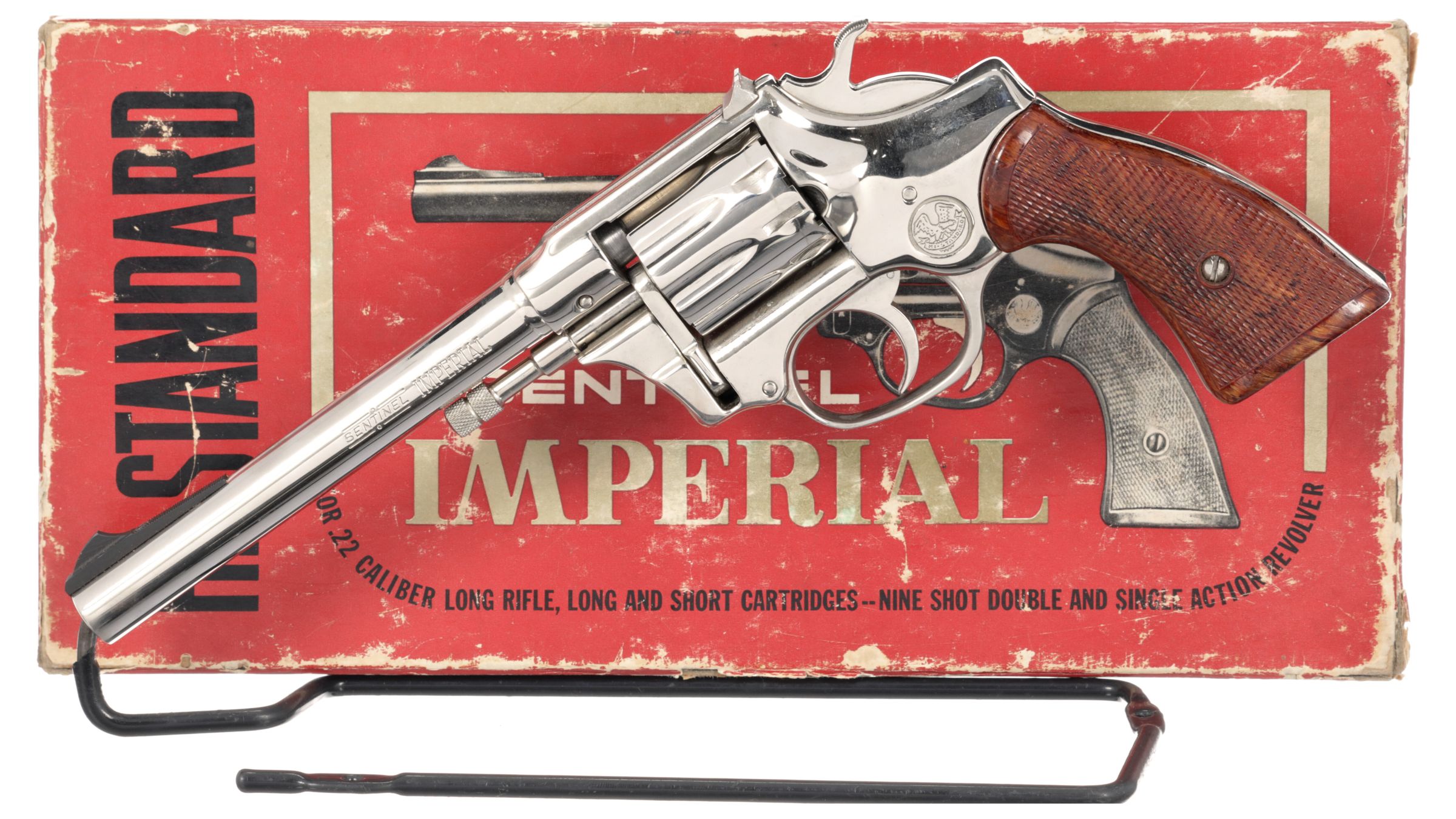 Figure 4 — A nickel Sentinel Imperial with its red Imperial box: the full-size grip frame and two-piece walnut grips of the 1961 R-104. Rock Island Auction photograph, used by owner decision.