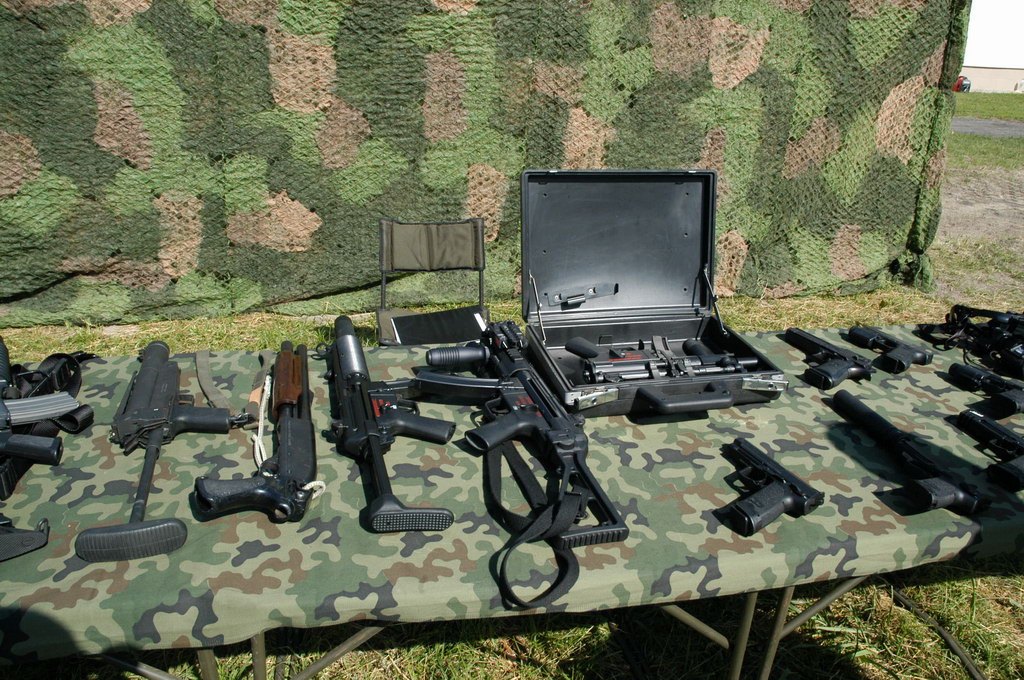 Figure 3 — GROM's equipment on display at the unit's 16th anniversary in 2006, from the Polish Ministry of National Defence. Commons files the photograph under the Mk 23, and GROM's own equipment page lists t…