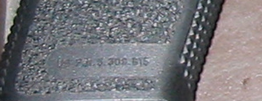 Figure 10 — The moulded panel on the right of a commercial Mark 23's grip, enlarged; it reads as a US patent number ending 5 309 815. The first characters are not legible in the photograph.