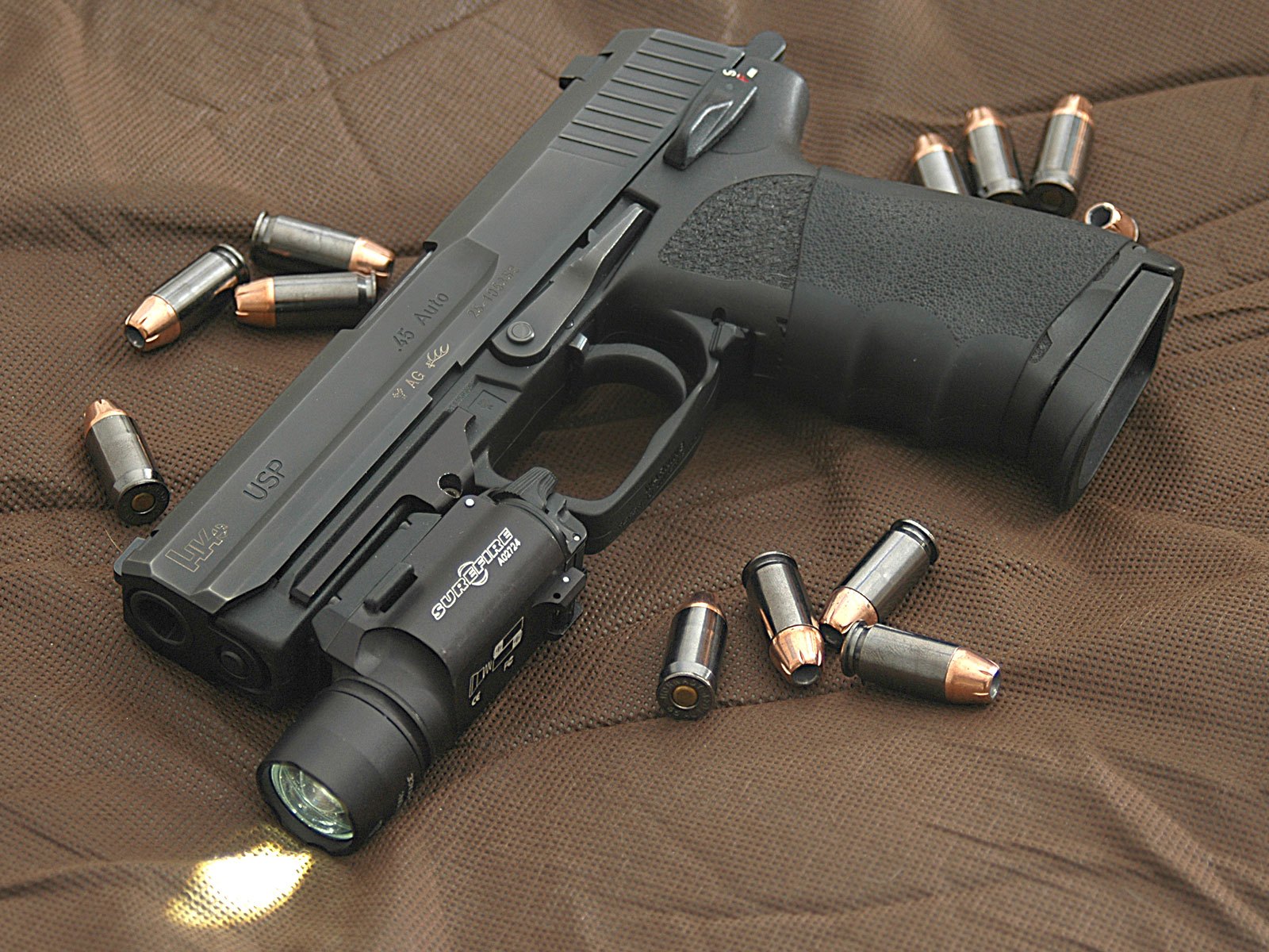 Figure 8 — A USP45 with a weapon light on its accessory rail. The USP's grooves accept lights like this one; the Mk 23's do not, and H&K's manual warns that USP accessories "will not work" on the Mark 23.