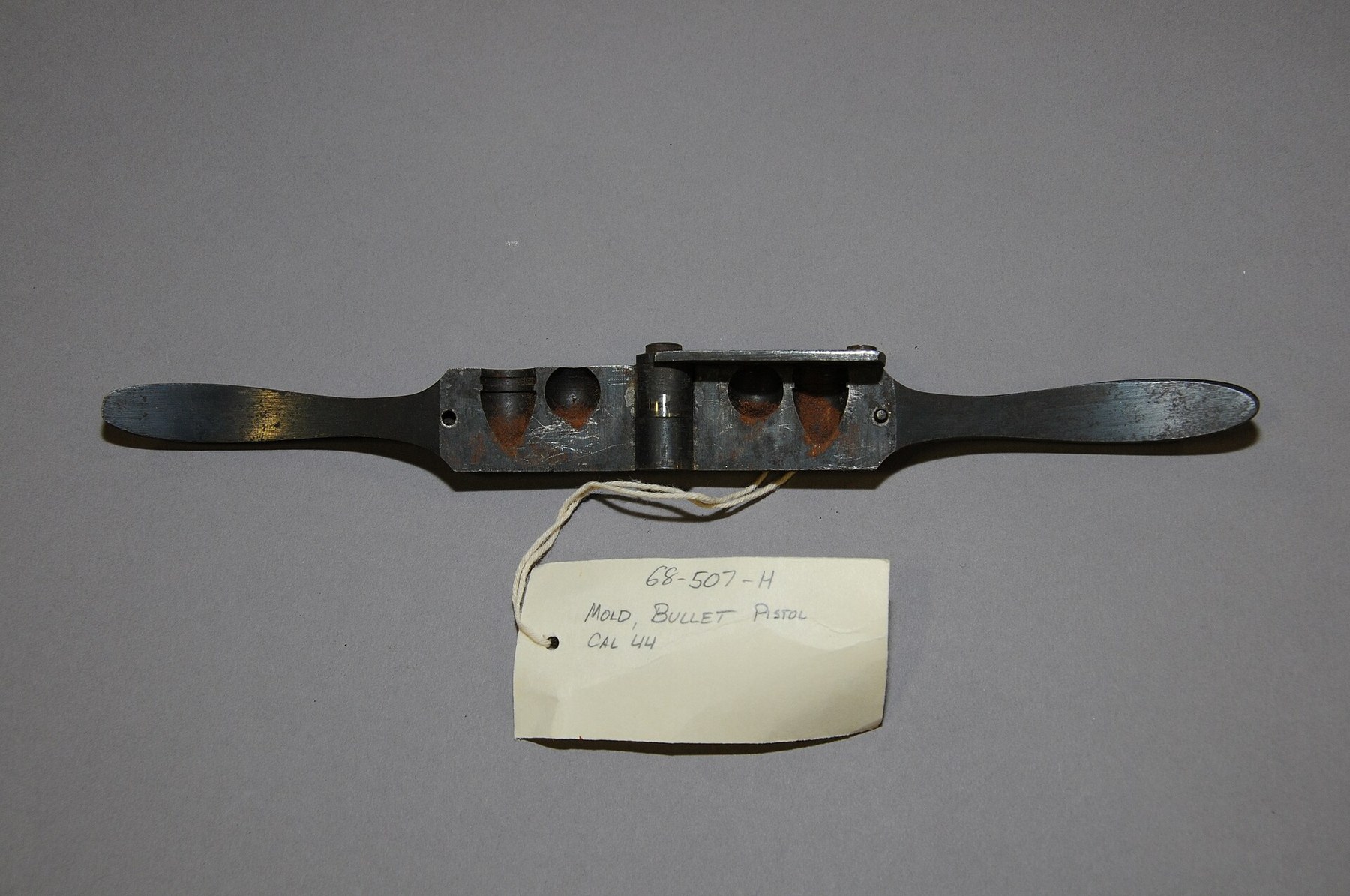 Figure 6 — A bullet mould for the Colt .44 revolver, of the type issued with percussion revolvers. LeMat moulds, much rarer, cast a .40 conical bullet and two .28 buckshot in one closing. Photograph from the …