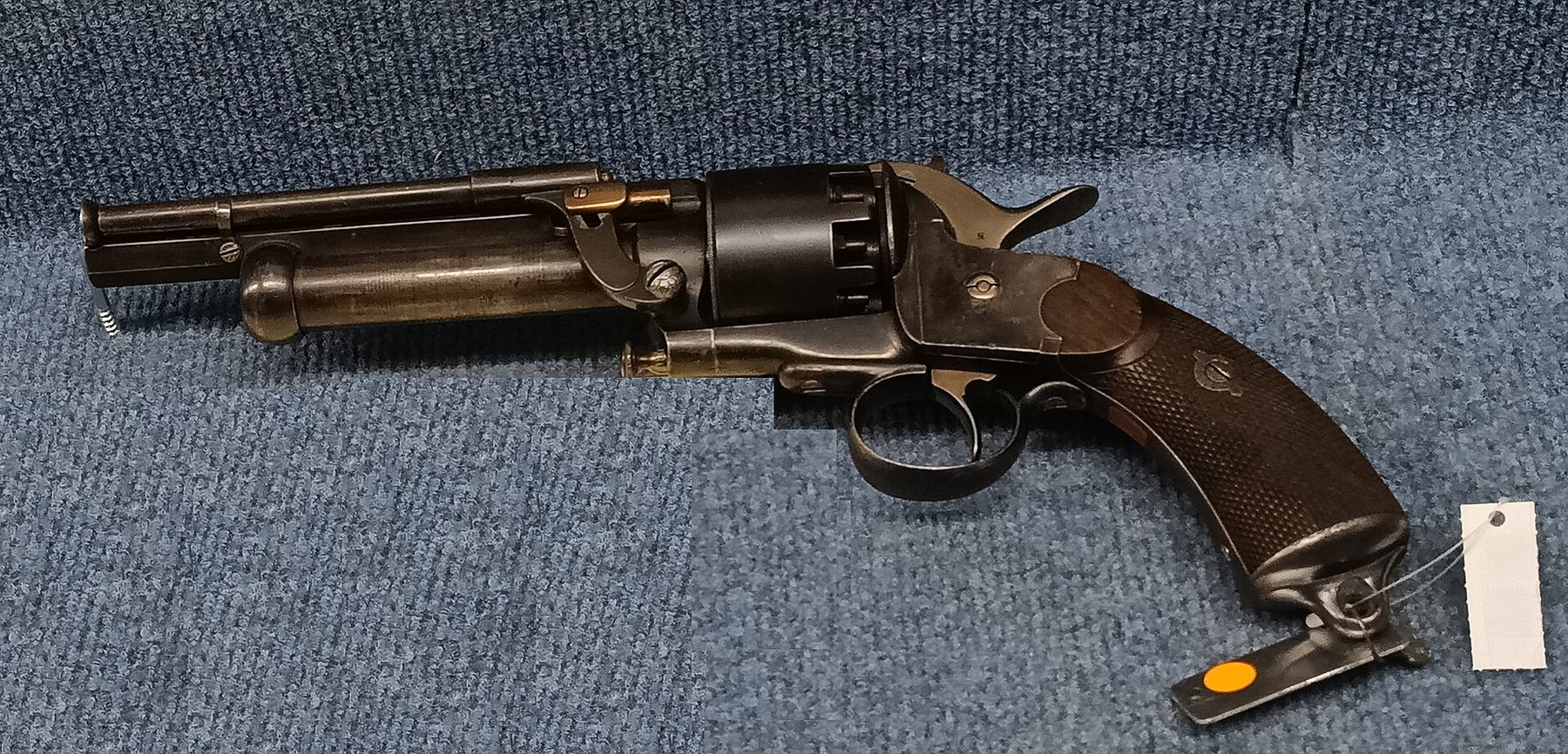 Figure 4 — A percussion LeMat in the Wehrtechnische Studiensammlung, Koblenz, photographed from the left side with the muzzle to the left. The trigger guard is round. The pixelated blocks at lower left are in…