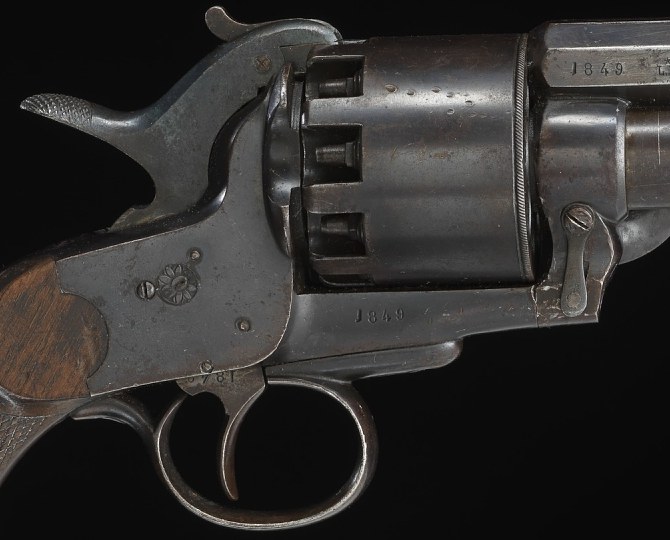 Figure 4 — The frame, cylinder and hammer of the Smithsonian's LeMat, cropped from the museum's photograph. The cylinder's rear face, the nipple recesses and the breech face around them are where an original'…