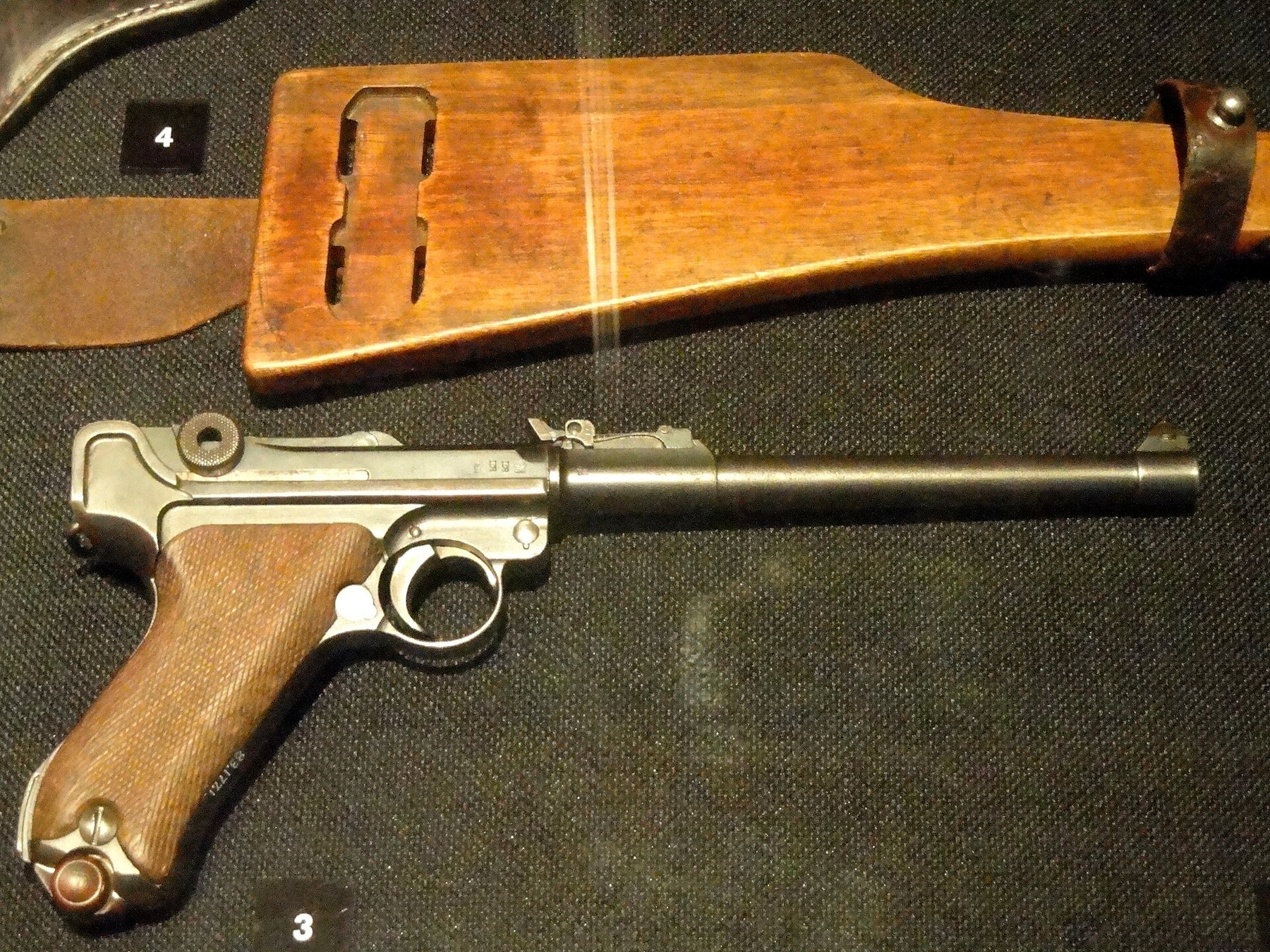 Figure 11 — A Lange Pistole 08 made by DWM in 1917, with its board stock and attached holster, in the National World War I Museum, Kansas City. The tangent rear sight sits on the barrel ahead of the receiver.