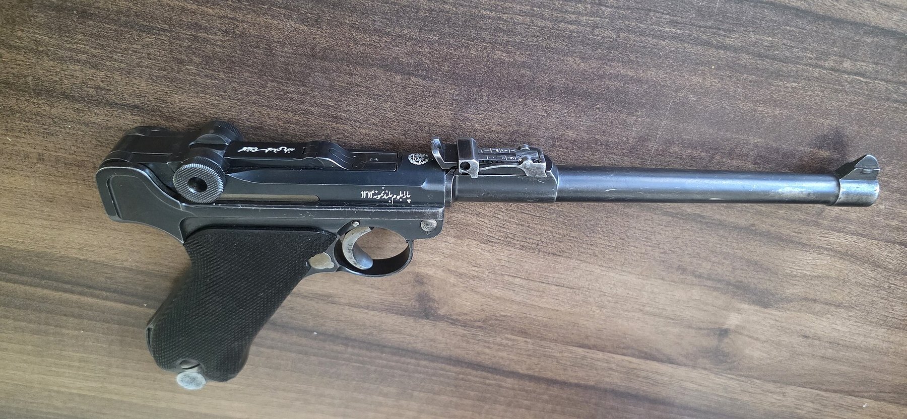 Figure 7 — A Persian long pistol made by Mauser, the inscriptions on the receiver and toggle in Farsi. Photographed for Commons to show all its markings.