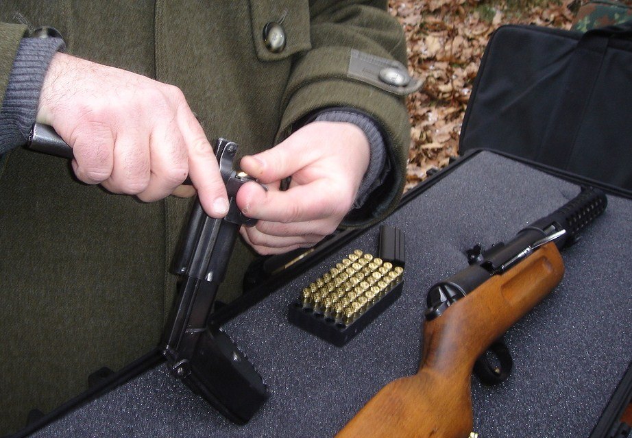 Figure 3 — Loading a TM 08 with its lever tool, which winds the spring and holds it while rounds are pressed in. The drum here is shown with an MP 18; the same drum and tool served the long pistol. Photograph…