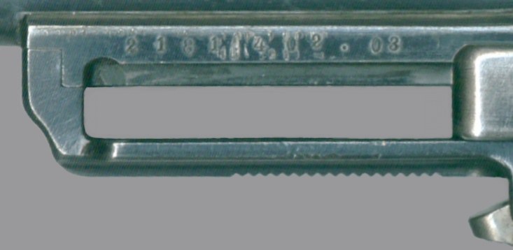 Figure 5 — The frame of an M1901 under its slide, with a stamped number line ending in what appears to be the year ". 03". Photograph: Wesley Terrell, CC BY-SA 3.0, via Wikimedia Commons.