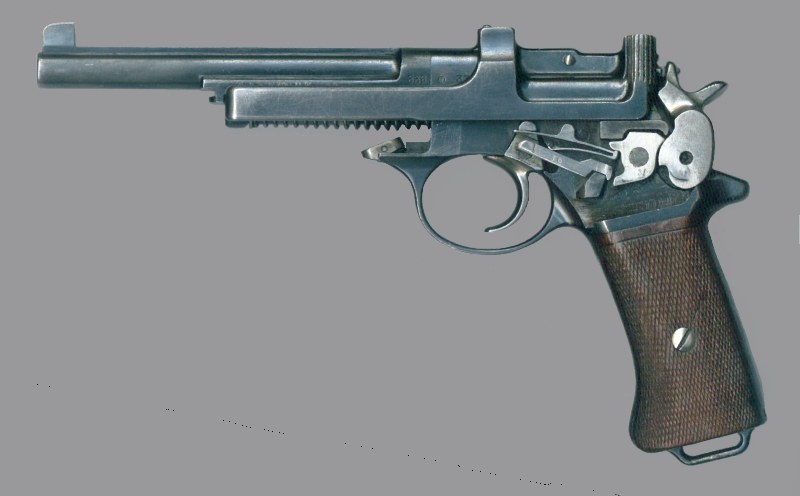 Figure 1 — An M1901 with the left cover removed: trigger, trigger bar, sear and its spring, and the left fork of the hammer. Photograph: Wesley Terrell, CC BY-SA 3.0, via Wikimedia Commons.