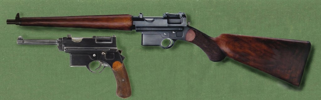 Figure 5 — The Mannlicher locked-breech family as photographed together: a pistol and a carbine. Uploaded to Commons as "Mannlicher System 96 03", CC0. The photographer and the guns' location were not recorded.