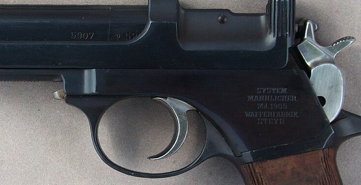 Figure 3 — The left side of an Argentine contract M1905: serial number on the barrel and chamber, and the five-line marking on the frame. Crop of a photograph by Self Loader, CC BY-SA 4.0, via Wikimedia Commons.
