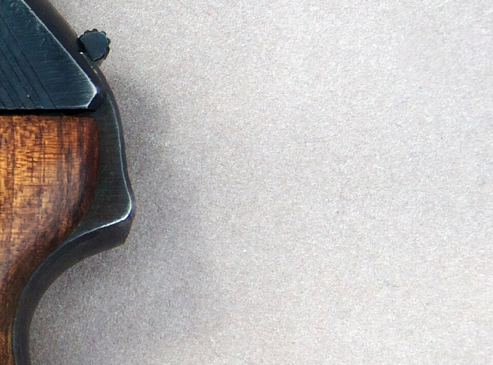 Figure 7 — The rear of a wartime HSc. The hammer spur stands just clear of the slide, enough for a thumb, and the shroud around it closes the slot it lives in. Interarms's own catalogue copy claims dirt exclu…