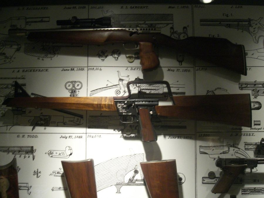 Figure 11 — Two carbines at the National Firearms Museum in 2005, both from the left: a Mark I Model B sporter with scope above, and the Model B military carbine with its lengthened carry handle below. Photogr…