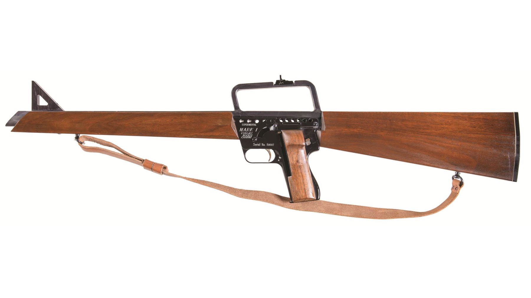 Figure 10 — The Mark I Model A military carbine, left side, with its leather sling: the pistol frame is buried in a wooden forend and buttstock, and the fixed carry handle over the receiver carries the rear si…