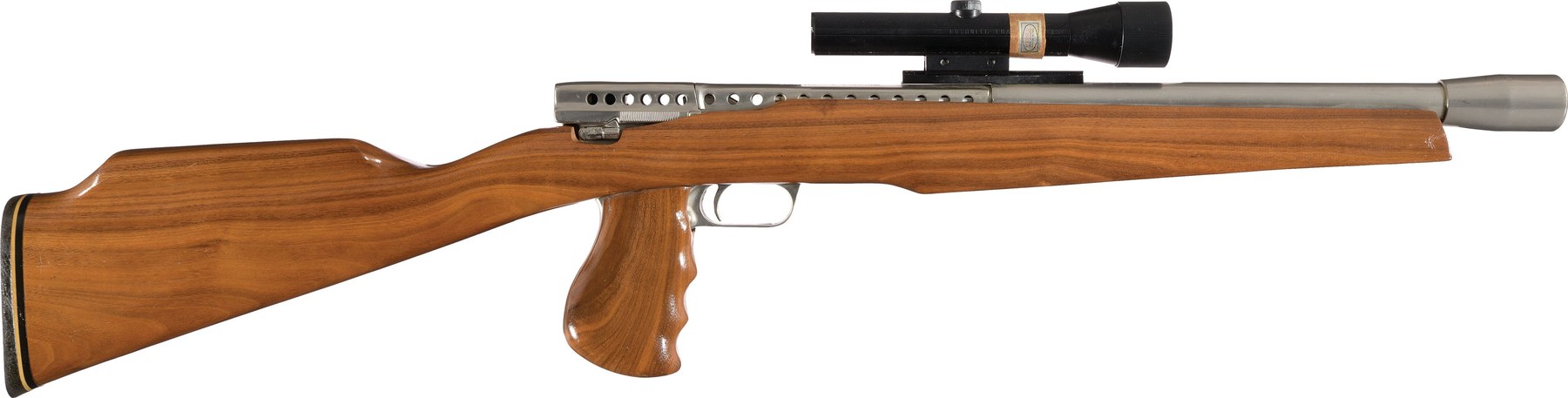 Figure 3 — The Mark I Model B sporter carbine: a standard pistol frame buried in a one-piece walnut stock with a roll-over cheekpiece and a separate finger-grooved grip, a Bushnell Phantom scope on a rail, a …