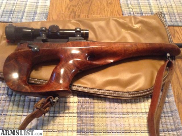Figure 7 — A rear-grip XP-100 in an aftermarket stock. Grip position is the fastest way to separate the original pattern from everything that came after it. Photo: Armslist listing, "Remington XP-100 7mm BR."