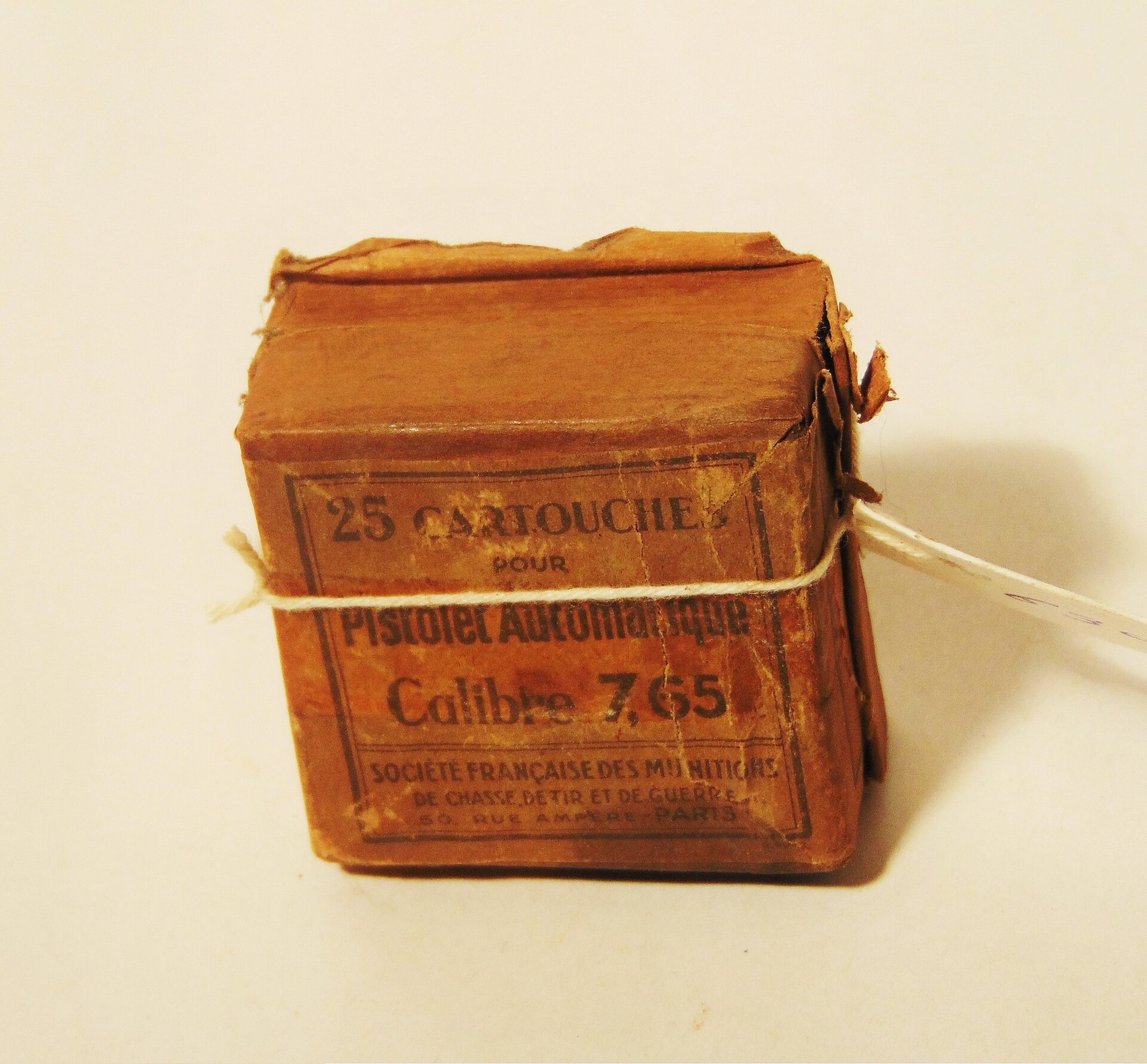 Figure 3 — A French wartime-era box: "25 cartouches pour pistolet automatique calibre 7,65", by the Société Française des Munitions de Chasse, de Tir et de Guerre, Paris. Photographed in the National Liberati…
