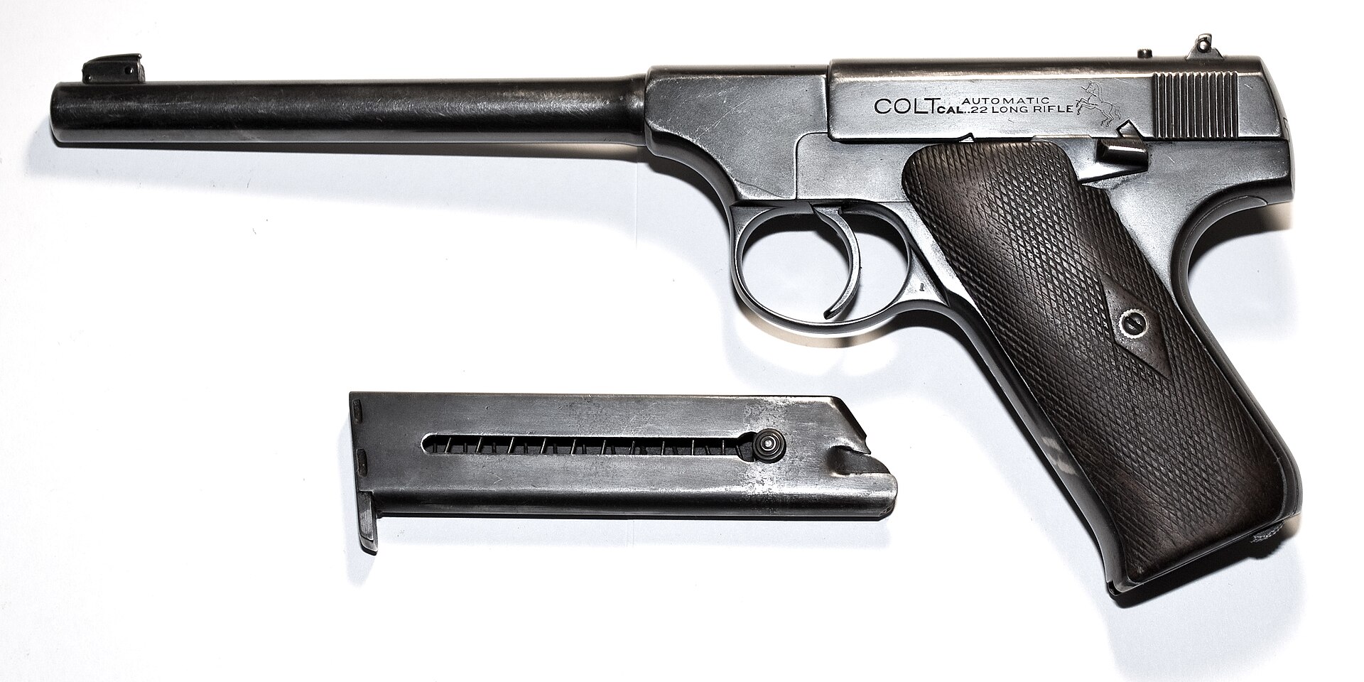 Figure 5 — An early First Series Colt Woodsman, the established American .22 target and sporting pistol when the Ruger Standard appeared. It is a Browning design with a machined steel frame and a reciprocatin…