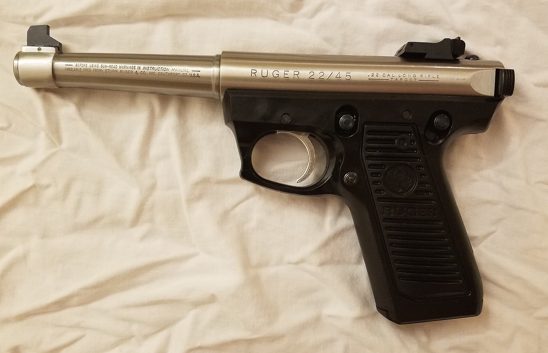 Figure 6 — A 22/45 Mark II Target. The polymer grip frame, with its steeper 1911 angle and moulded-in panels, is the identifying feature of the branch; the receiver and bolt are the same tube-and-cylinder des…