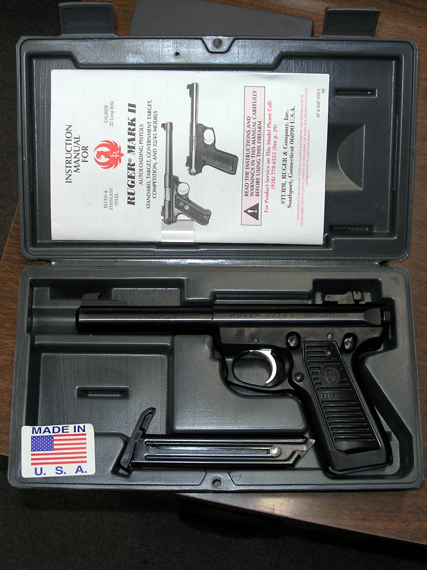Figure 4 — A Mark II in its factory case with the Ruger instruction manual. Every procedure in this volume comes from a manual like this one; Ruger makes them free to download for every generation, including …
