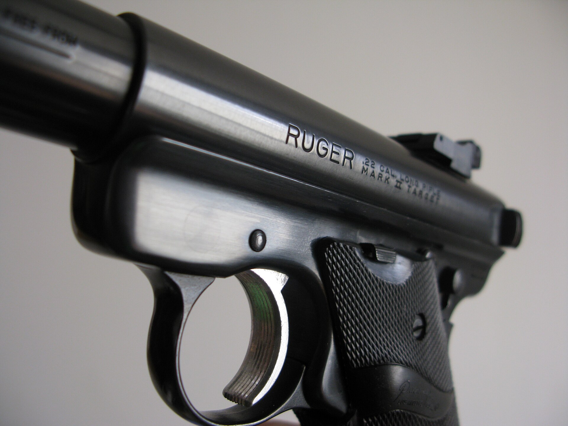 Figure 4 — A Mark II Target: the roll mark reads MARK II TARGET on the left of the receiver, and the small lever at the top of the grip panel is the bolt hold-open thumbpiece that the Mark II introduced. On a…