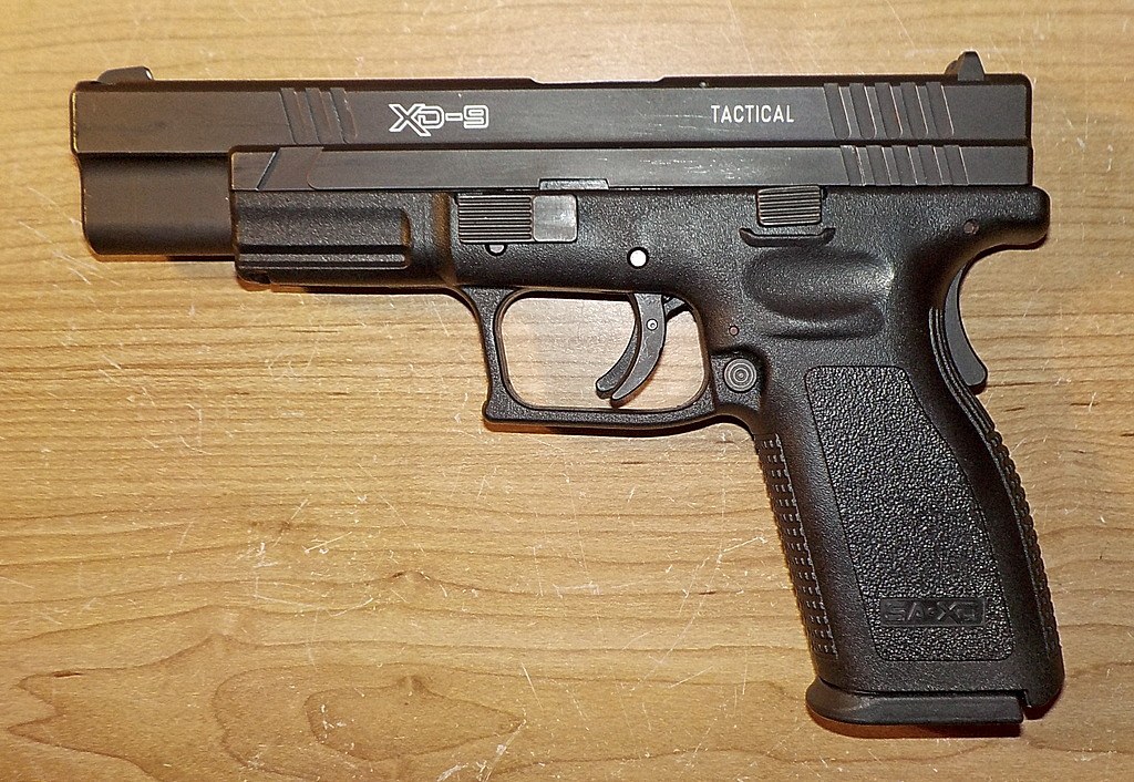 Figure 4 — An XD-9 Tactical, the 5-inch first-generation XD. The HS2000 slide profile and grip are unchanged from the Croatian pistol; the only visible Americanisation is the roll marking.