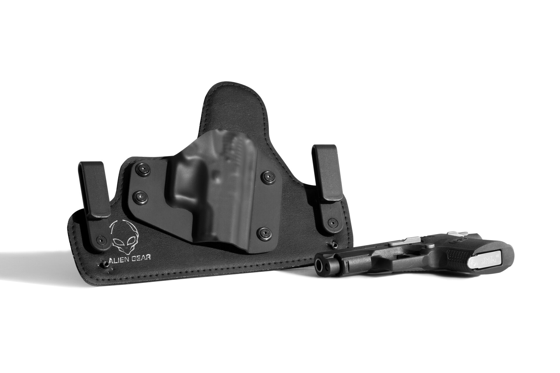 Figure 3 — A hybrid inside-the-waistband holster — a moulded polymer shell on a wide backer. Whether the shell's sight channel clears an optic is a property of that shell, not of the pistol.