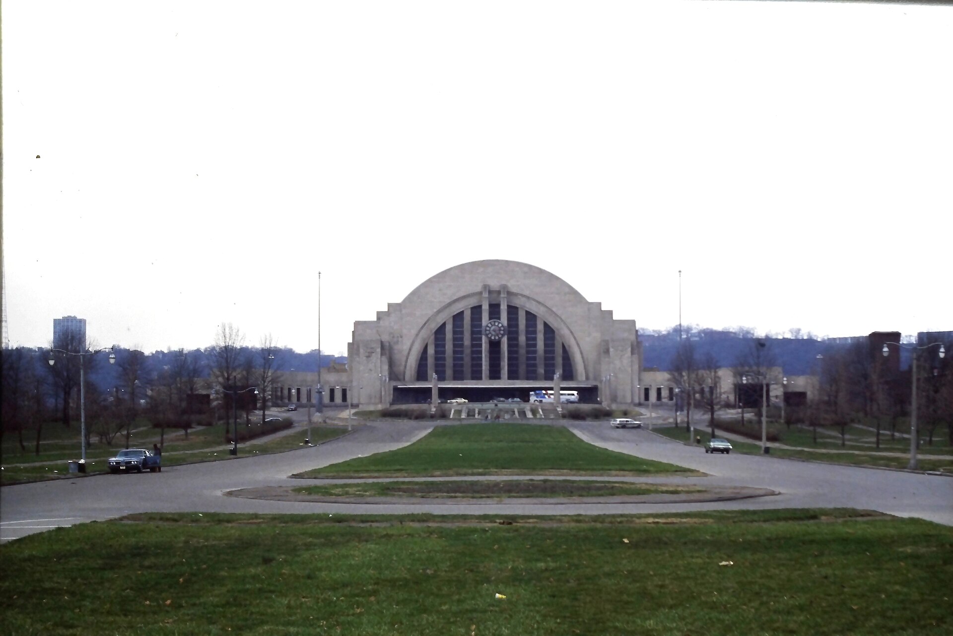 Figure 4 — Cincinnati Union Terminal (1933): streamline moderne at architectural scale — a single swept form, long horizontal lines, ornament replaced by curvature. The style's industrial-design wing, applied…