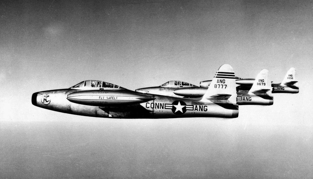 Figure 3 — Four F-84D Thunderjets of the Connecticut Air National Guard's 118th Fighter-Bomber Squadron in formation, 1954. The F-84 was Republic's first jet fighter, and its nose gun installation — the gun d…