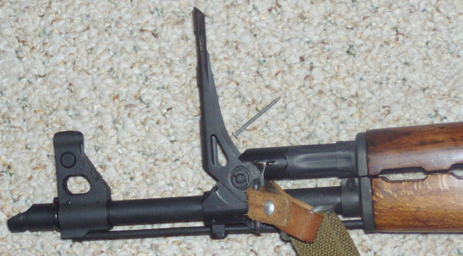 Figure 2 — The folding grenade-launching sight raised on a Yugoslav rifle's gas block, with the launching spigot at the muzzle. With the ladder up the gas cut-off is closed and the rifle will not cycle — it i…