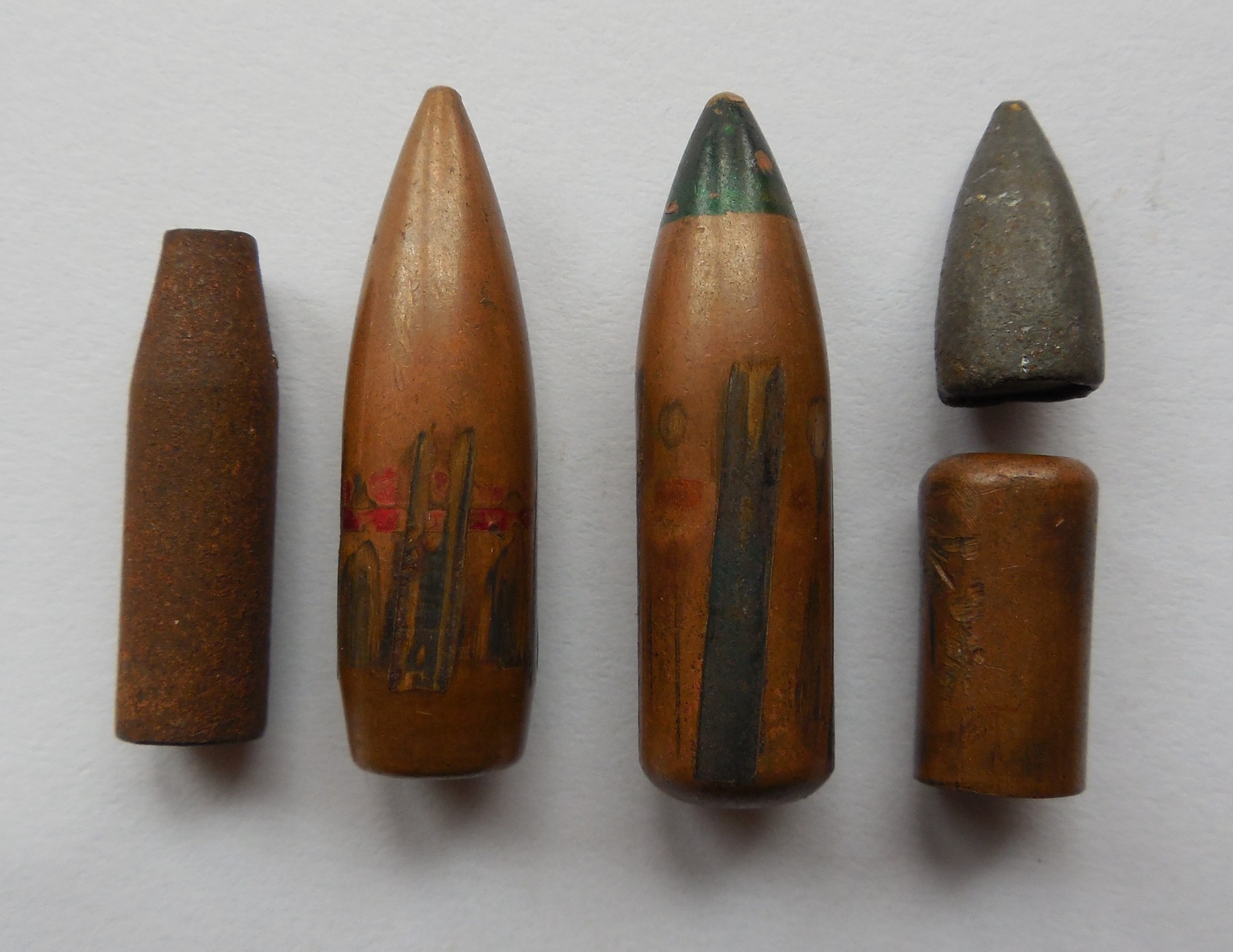 Figure 4 — Standard military 7.62×39 projectiles, including a green-tipped tracer. The steel-cored ball round in the middle is what the overwhelming majority of the world's AK ammunition has always been.