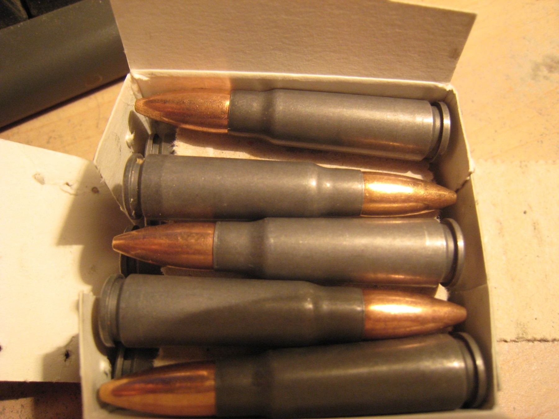 Figure 6 — A box of steel-cased M43 ammunition. Steel cases are a materials-economy decision, not a performance one, and the AK was built for them from the beginning.