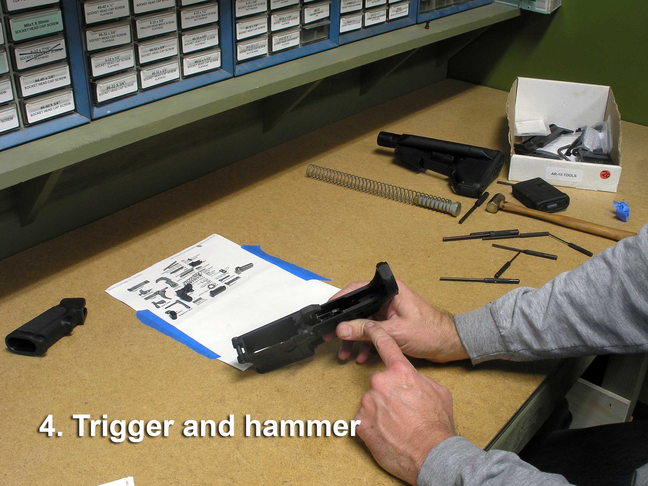 Figure 3 — A fire control group being installed in a lower receiver. On a build using a stripped lower this is the step that determines how the finished rifle feels.