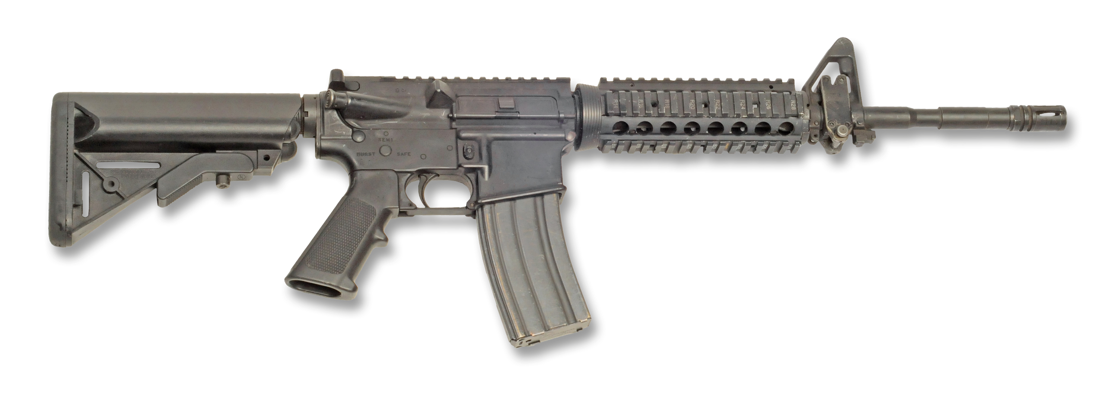 Figure 1 — An M4-pattern carbine with a rail adapter system, the configuration most people picture when they hear the word. Everything structurally characteristic of the type is visible: the split receiver wi…
