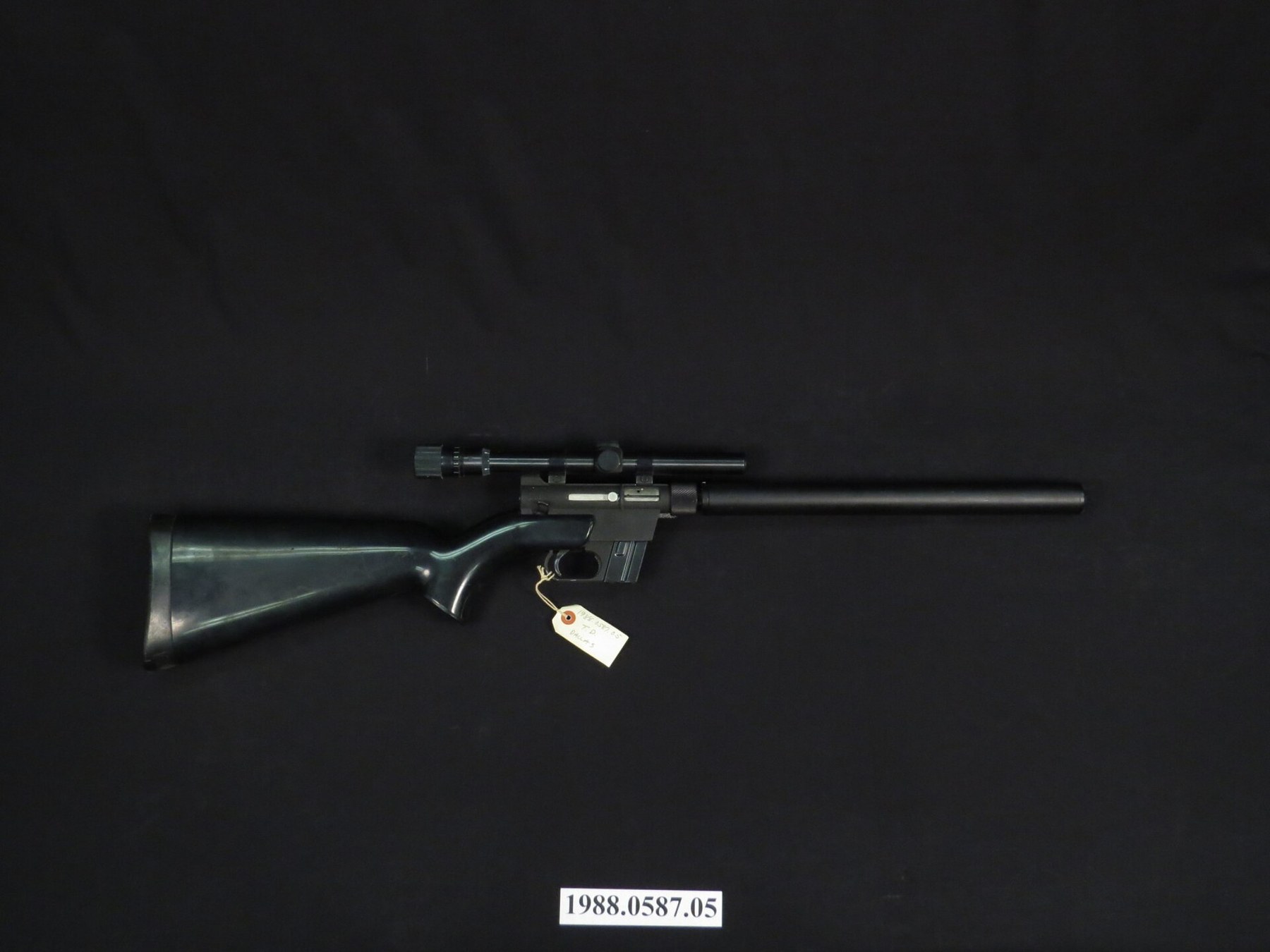 Figure 1 — A Charter Arms AR-7 Explorer in the Smithsonian's National Museum of American History, fitted with a telescopic sight on an add-on mount. Charter rifles are finished in a textured black enamel and …