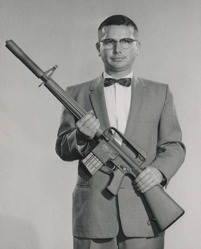 Figure 4 — Eugene Stoner holding an early ArmaLite AR-10 prototype, late 1950s. The AR-5, AR-7, AR-10 and AR-15 all came out of the same small ArmaLite engineering group in these years. ArmaLite photograph, p…