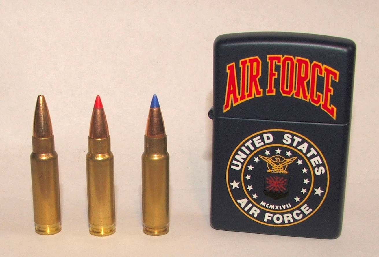 Figure 4 — Three 5.7×28mm rounds showing tip colour coding. Tip colour is the fastest field identification for this cartridge family, and it is the reason a photograph of a coloured tip is frequently mistaken…