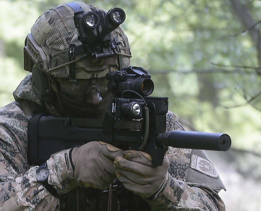 Figure 9 — An Austrian Jagdkommando soldier with a suppressed, optic-equipped P90. Austria's Jagdkommando is recorded as holding 140 weapons — the typical scale of a P90 purchase.